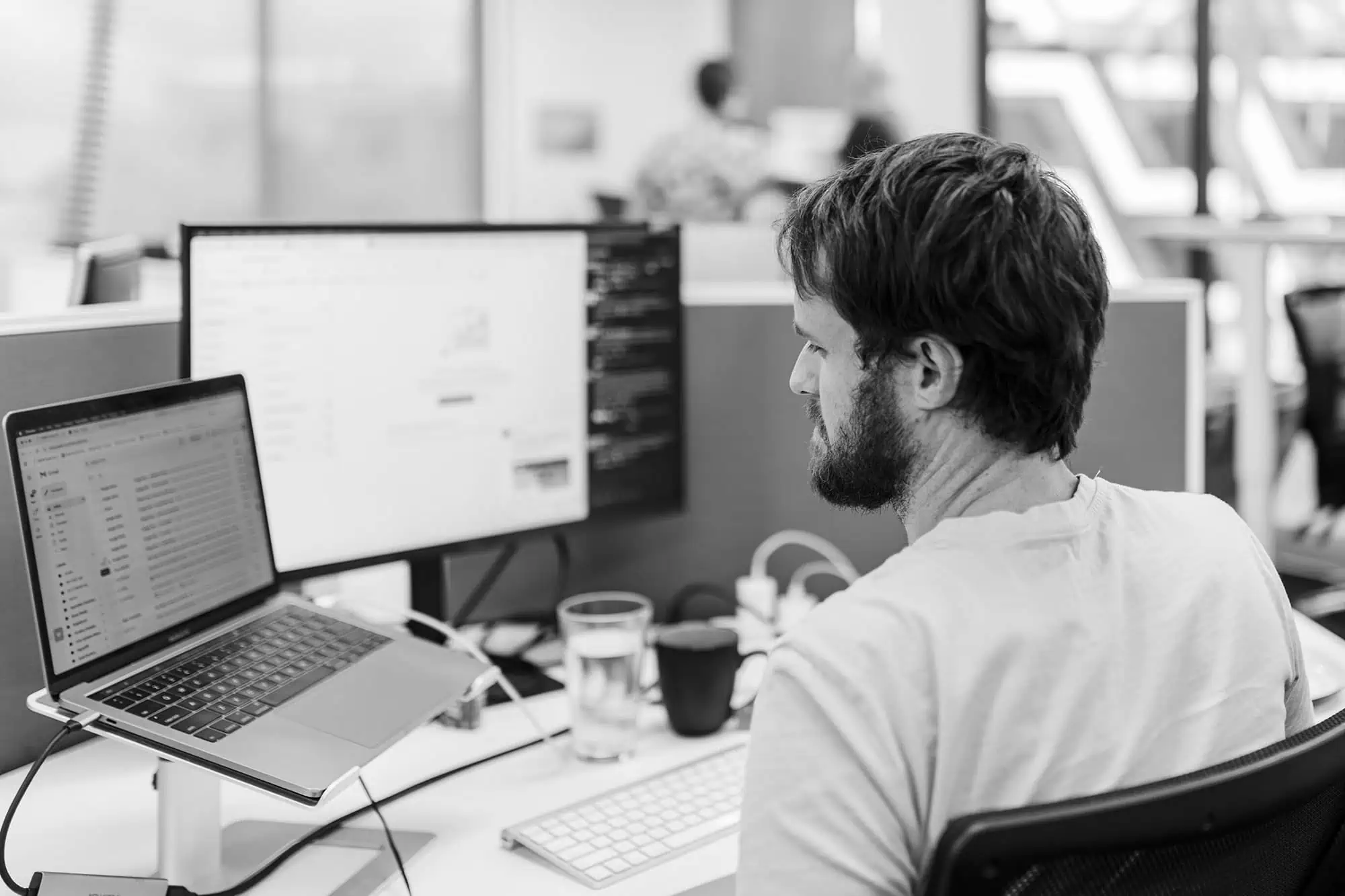 SEO Specialist, Ed in front of his laptop and desktop