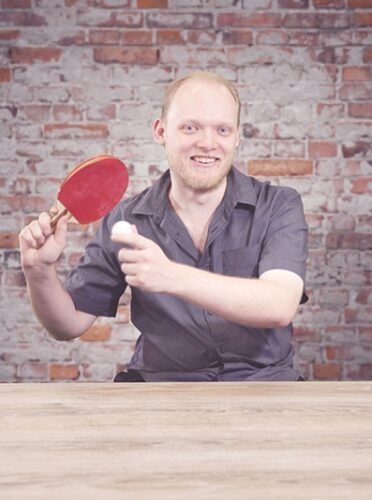 Jamie Smith holding table tennis ball